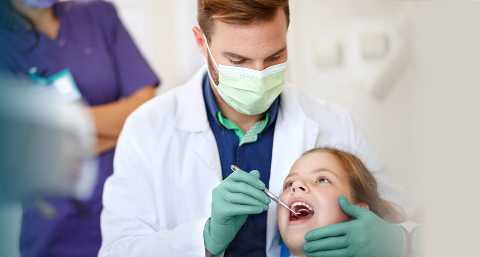 a girl patient and a dentist in a dental clinic